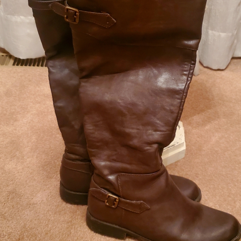 Women's tall brown zip up boots with buckel accent